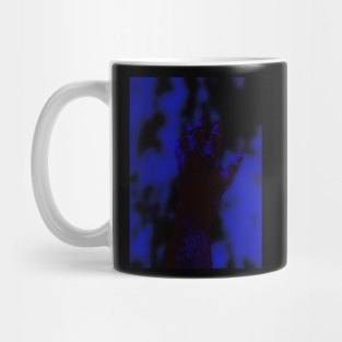 Digital collage and special processing. Psychedelic. Hand reaching on top of some bizarre surface. Blue and blur. Mug